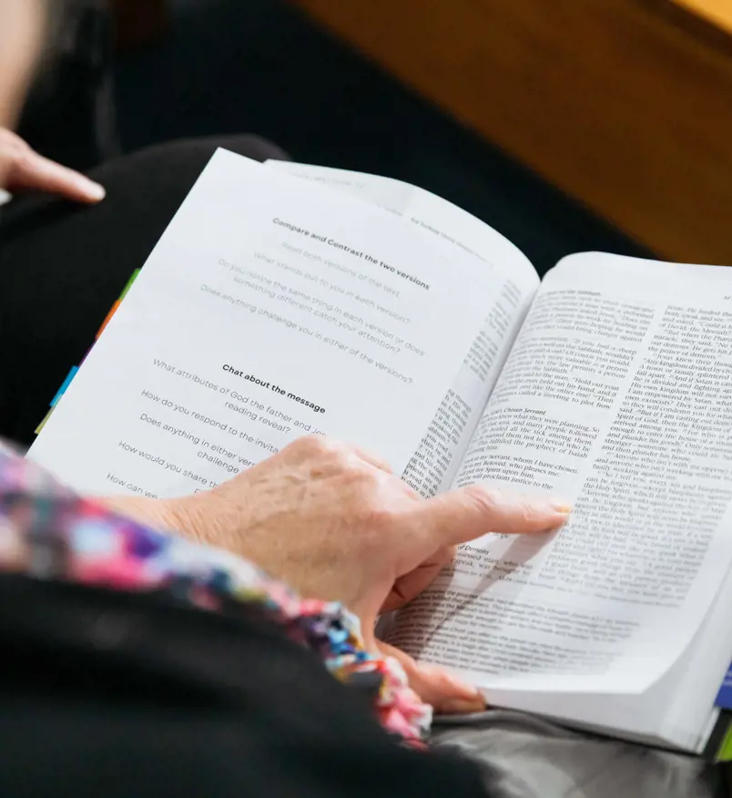 Elderly person reading bible