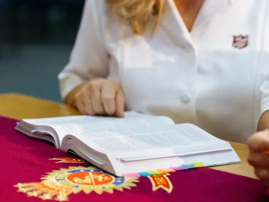 Officer at workship with their bible