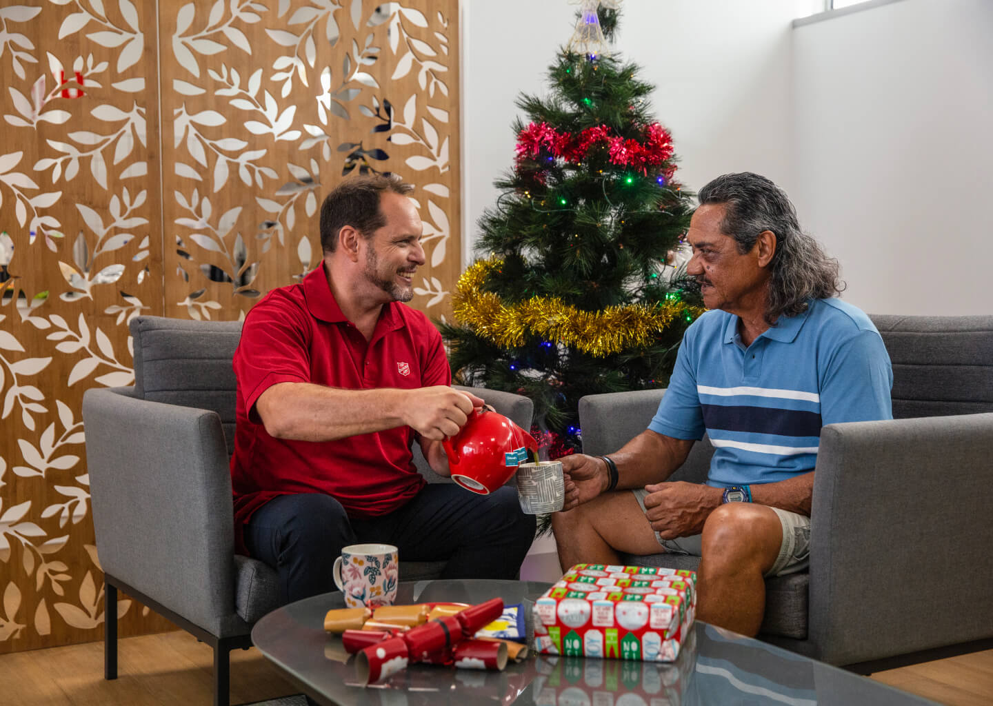 A  Salvos officer serving up a delightful cup of tea this Christmas!