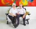 Joy (right) and Jim (left) sitting together and smiling