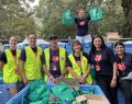 Volunteer Jason (centre, in hat) with a Salvos team packing and selling candle bags to support people who are struggling.