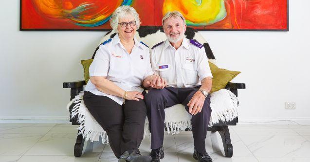 Joy (right) and Jim (left) sitting together and smiling