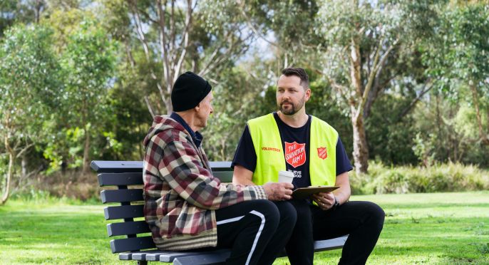 Salvos volunteer helping a person in need.