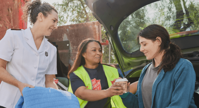 Salvos Officers helping a person in need.