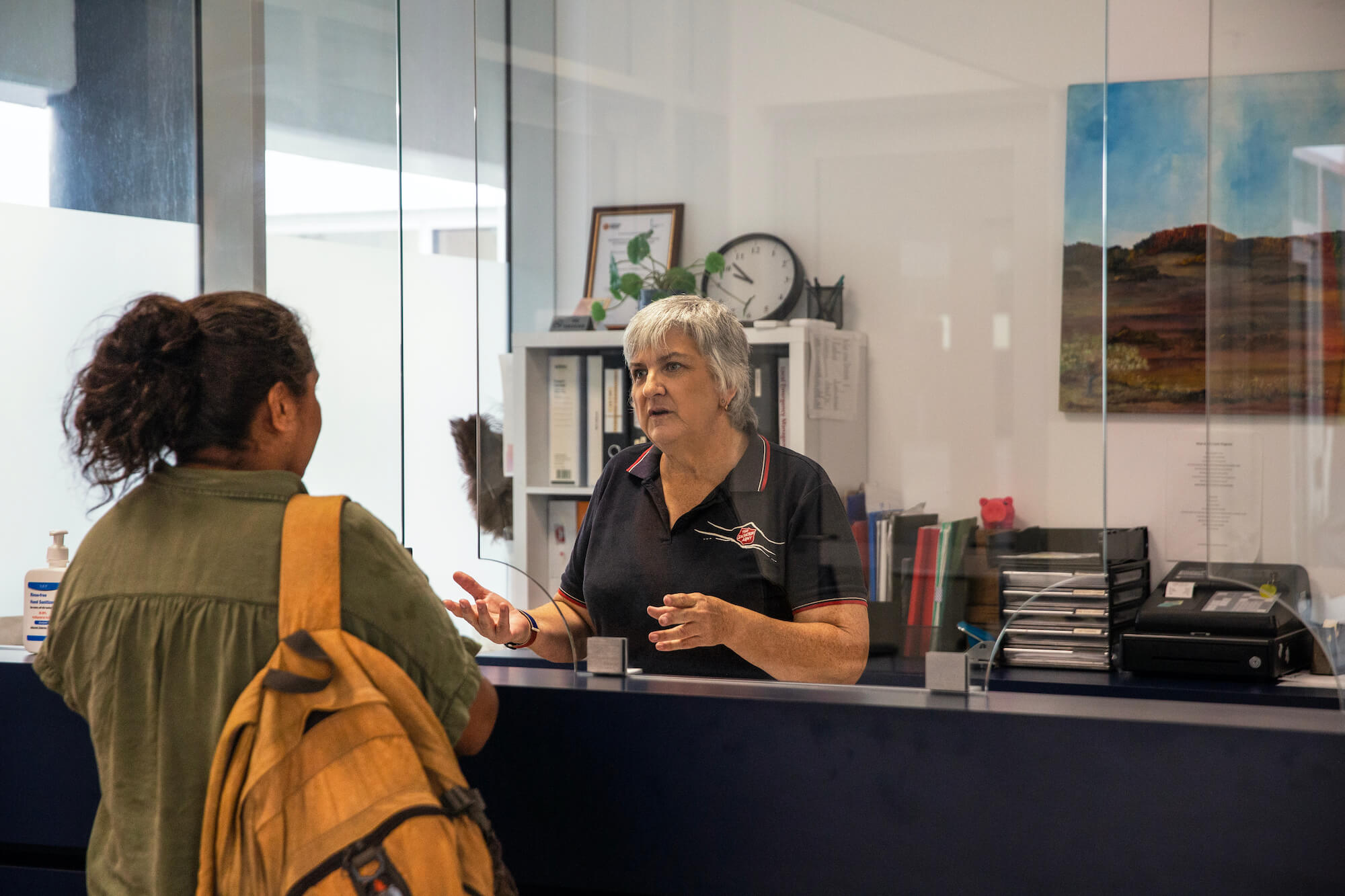 a Salvo officer chatting with a woman