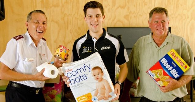 The Salvation Army's Major Peter Sutcliffe (left) is presented with donated goods for the 'Fill a Fridge' initiative.