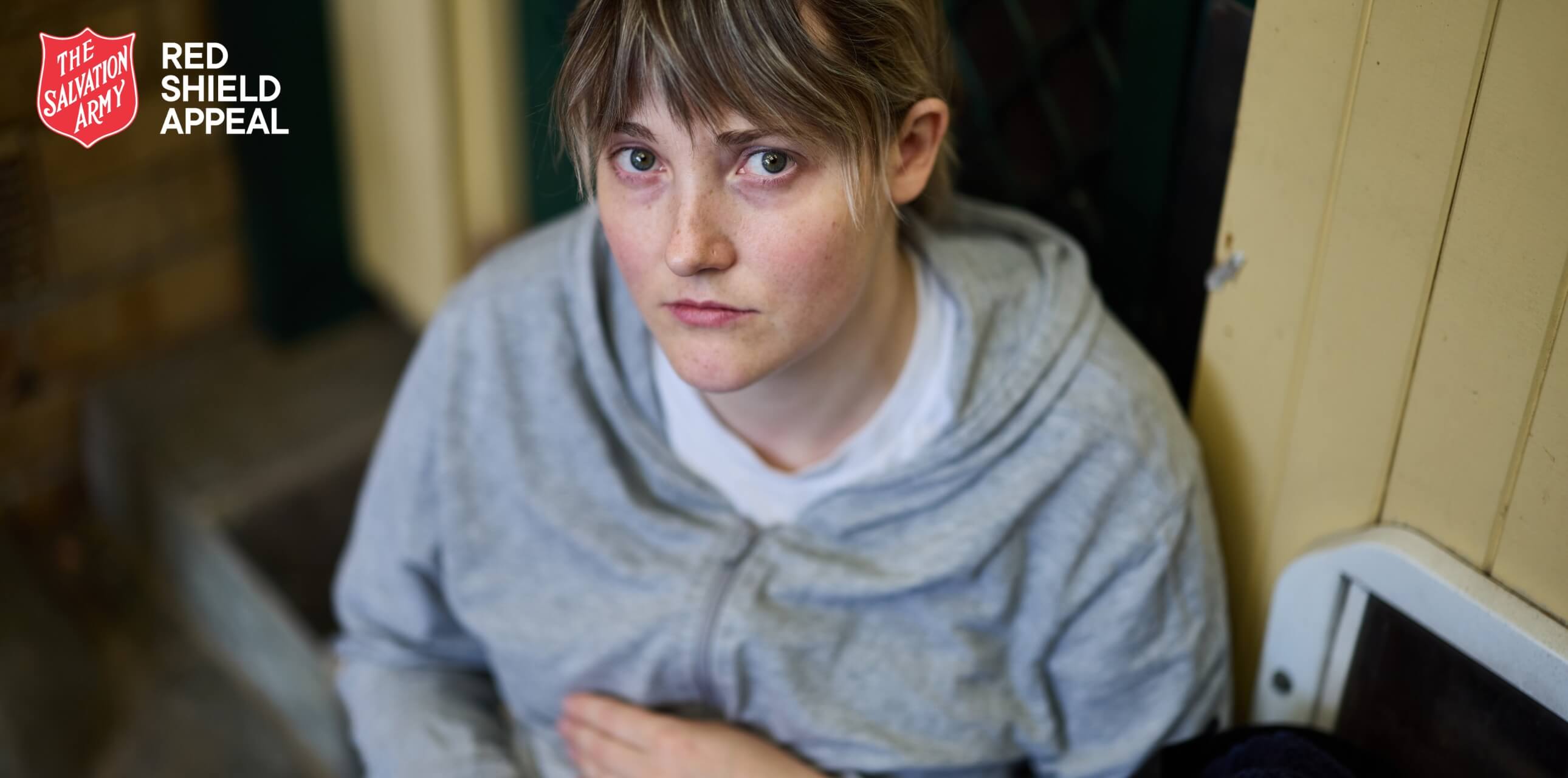 Emily looking distressed as she sits outside without a home for the night.