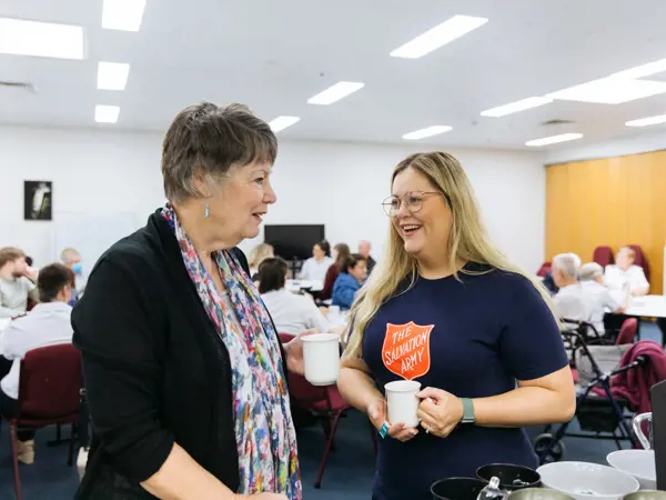 Two women talking while drinking tea